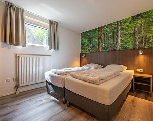 Slaapkamer met en suite badkamer in vrijstaande woning Vaassen, Veluwe.