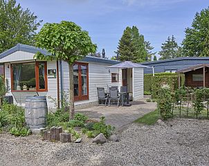 Vakantiehuis Hermelijn in Hulshorst, Veluwe met charmant terras en groene omgeving.