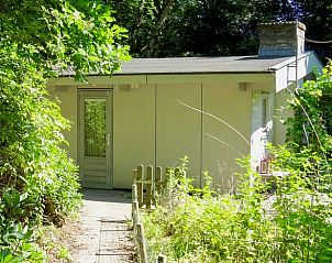 Ingang van Vakantiehuisje in Hulshorst, verscholen in het groen van de Veluwe, Gelderland.