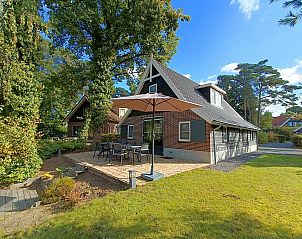 Geheim van Otterlo 8 vakantiehuis in Otterlo, Veluwe, met zonnig terras en groene omgeving voor een ontspannen verblijf in Gelderland.