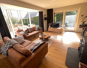 Cozy living room in Holiday Home in Epe, Veluwe, Gelderland with spacious sitting area and lots of natural light.