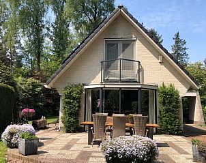 Enjoy the terrace at Holiday home in Epe, a charming vacation home in Veluwe, Gelderland, surrounded by green nature.
