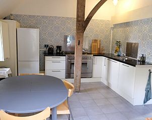 Modern kitchen in Holiday cottage in Epe, Veluwe, Gelderland with stylish tiles and wooden beams.