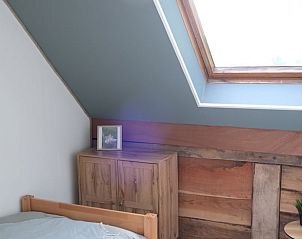Bedroom in Holiday Home in Epe, Veluwe, Gelderland with wooden closet and skylight for lots of light.