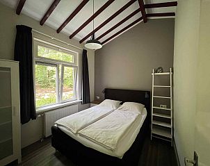 Gezellige woonkamer in DG395 vakantiehuis Epe Veluwe