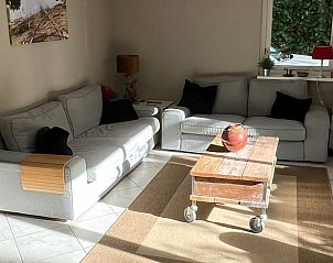 Cozy living room in Cottage in Epe, Veluwe, Gelderland with comfortable sofas and lots of natural light.