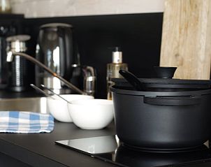 Modern kitchen in Holiday Home in Epe, Veluwe, Gelderland, with stylish stove and crockery for a comfortable stay.