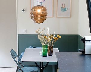 Dining area with decorative flowers in Cottage in Nunspeet, Veluwe, Gelderland.
