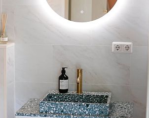 Stylish sink in bathroom of Huisje in Nunspeet, vacation home in Veluwe, Gelderland.