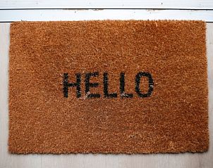 Welcome mat at the entrance of Huisje in Nunspeet, vacation home in the Veluwe, Gelderland.