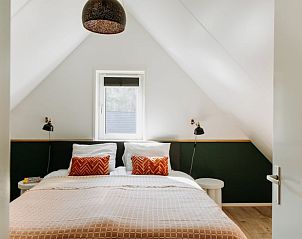 Bright bedroom in Holiday Home in Nunspeet, Veluwe, with a comfortable double bed and modern furnishings.