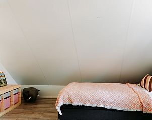 Cozy children's room in Cottage in Nunspeet, Veluwe, with playful furnishings and comfortable beds.