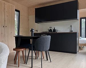 Modern kitchen and dining area in Holiday home in Nunspeet, Veluwe, Gelderland, with stylish interior and comfortable amenities.