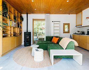 Cozy living room with wood stove in Holiday cottage in Nunspeet, Veluwe, Gelderland.
