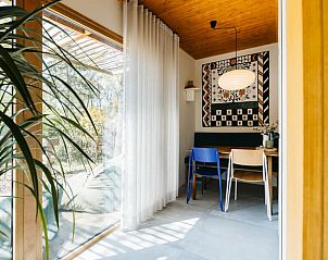 Dining area overlooking nature in Holiday home in Nunspeet, Veluwe, Gelderland.