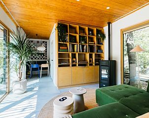 Spacious indoor space with bookshelves in Holiday cottage in Nunspeet, Veluwe, Gelderland.
