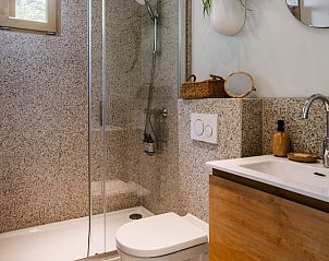 Modern bathroom with natural stone in Holiday cottage in Nunspeet, Veluwe, Gelderland.