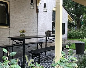Spacious terrace with picnic table at Holiday home in Nunspeet, Veluwe, Gelderland.