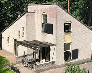 Exterior of Holiday home in Nunspeet, Veluwe, Gelderland with green garden.