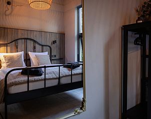 Bedroom with mirror in Holiday home in Nunspeet, Veluwe, Gelderland.