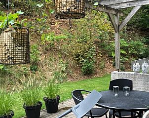 Outdoor space with sitting area at Holiday home in Nunspeet, Veluwe, surrounded by nature.