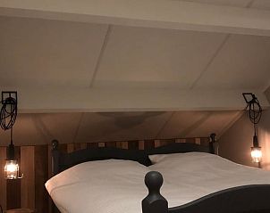 Cozy attic room with bed in Holiday home in Nunspeet, Veluwe, Gelderland.