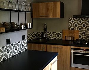 Modern kitchen in Holiday home in Nunspeet, Veluwe, with stylish finish.