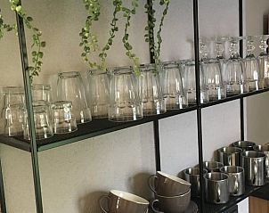 Open kitchen with glasses and cups in Holiday home in Nunspeet, Veluwe, Gelderland.