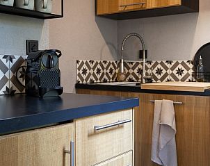 Kitchen with modern appliances in Holiday home in Nunspeet, Veluwe, Gelderland.