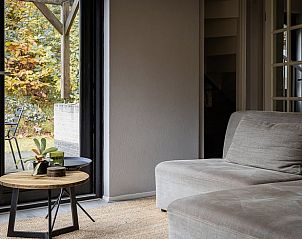 Spacious sitting area overlooking terrace in Holiday home in Nunspeet, Veluwe.