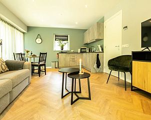 Cozy living room of Holiday Home in Lunteren, Veluwe, Gelderland with modern furnishings.