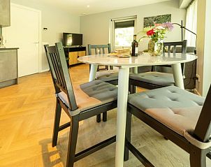 Dining area in Holiday home in Lunteren, Veluwe, Gelderland with stylish furniture.