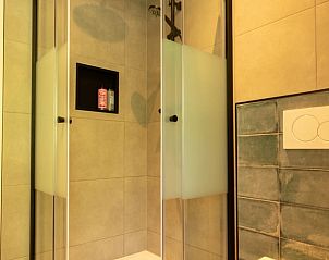 Stylish bathroom in Holiday Home in Lunteren, Veluwe, Gelderland with modern shower.