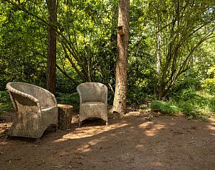 Cozy sitting area in the garden of Holiday Home in Lunteren, Veluwe, Gelderland.