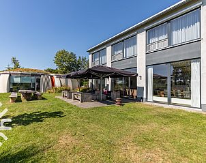 Stijlvolle slaapkamer in DG123 vakantiehuis Teuge Veluwe met modern interieur.