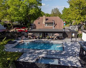 Pool facilities at Holiday home in Lieren, surrounded by green Veluwe countryside.