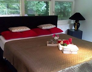 Gezellige slaapkamer met comfortabel bed in Veluwse Logeerboerderij vakantiehuis, Laag Soeren, Veluwe.