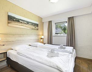 Slaapkamer met eenpersoonsbedden in Rabbit Hill bungalow, Nieuw Milligen.