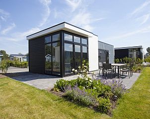 Cube la Mer 4 vakantiehuis in Nijkerk Veluwe met zonnig terras en tuin, ideaal voor een ontspannen verblijf in de natuur van Gelderland.
