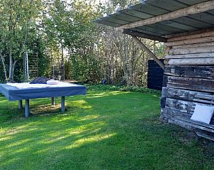 Relaxhoek in de tuin van Vakantiehuis in Kootwijkerbroek, Veluwe, Gelderland.