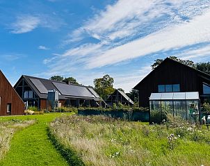 Omgeving van Huisje in Veessen, Veluwe, met weelderige natuur en moderne vakantiehuizen in Gelderland.