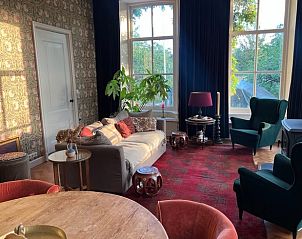 Zonnige leefruimte in Huisje in Thesinge, vakantiehuis in Noordoost Groningen, Groningen.