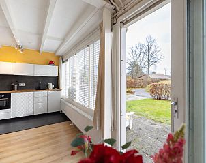 Cozy fireplace in Pronkjewail vacation home, ideal for cozy evenings in Lauwersoog, Groningen.