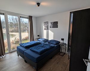 Slaapkamer met uitzicht in de vrijstaande woning in Belfeld, Noord Limburg.
