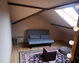 Knusse zolderruimte in Vakantiehuisje in America, Noord Limburg, met gezellige zithoek.