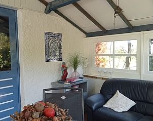 Gezellige binnenruimte van Vakantiehuis in Baarlo, Limburg, met comfortabele zithoek.