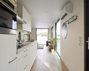 Modern kitchen in Water Cube vacation home for 2 people in Maasbree, North Limburg overlooking nature and water.