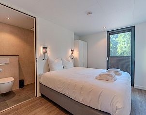 Attractive bedroom in Bos Cabin with Jacuzzi in Maasbree, North Limburg, vacation home for 2 people with views of nature.