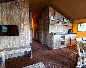 Cozy interior of Waterlodge in Maasbree, North Limburg, with wooden interior for 8 people, ideal vacation home for nature lovers.