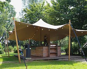 Glamptent in Maasbree, North Limburg offers a unique glamping experience with a spacious veranda and natural surroundings for 4 people.